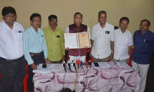 Godavari Conservation Samiti President TK Visweswara Reddy (Centre) who received an honorary doctorate from the British National University