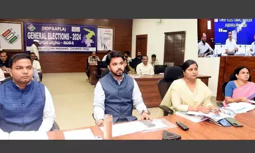 Collector V Prasanna Venkatesh, Joint Collector B Lavanyaveni, and others in Eluru on Sunday attending video conference of Chief Electoral Officer Mukesh Kumar Meena