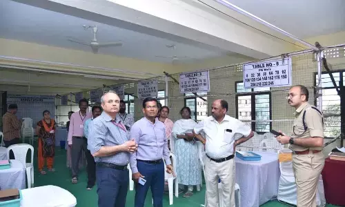 Collector AS Dinesh Kumar and SP Garud Sumit Sunil inspecting arrangements at the counting centre in Ongole on Monday