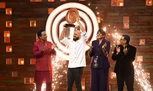 Mahboob Vin Basha from Anantapur lifts the trophy of MasterChef India Telugu