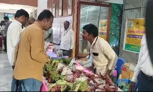 A former explaining organic products at Tarang FPO Mela at Mahati Auditorium in Tirupati on Thursday