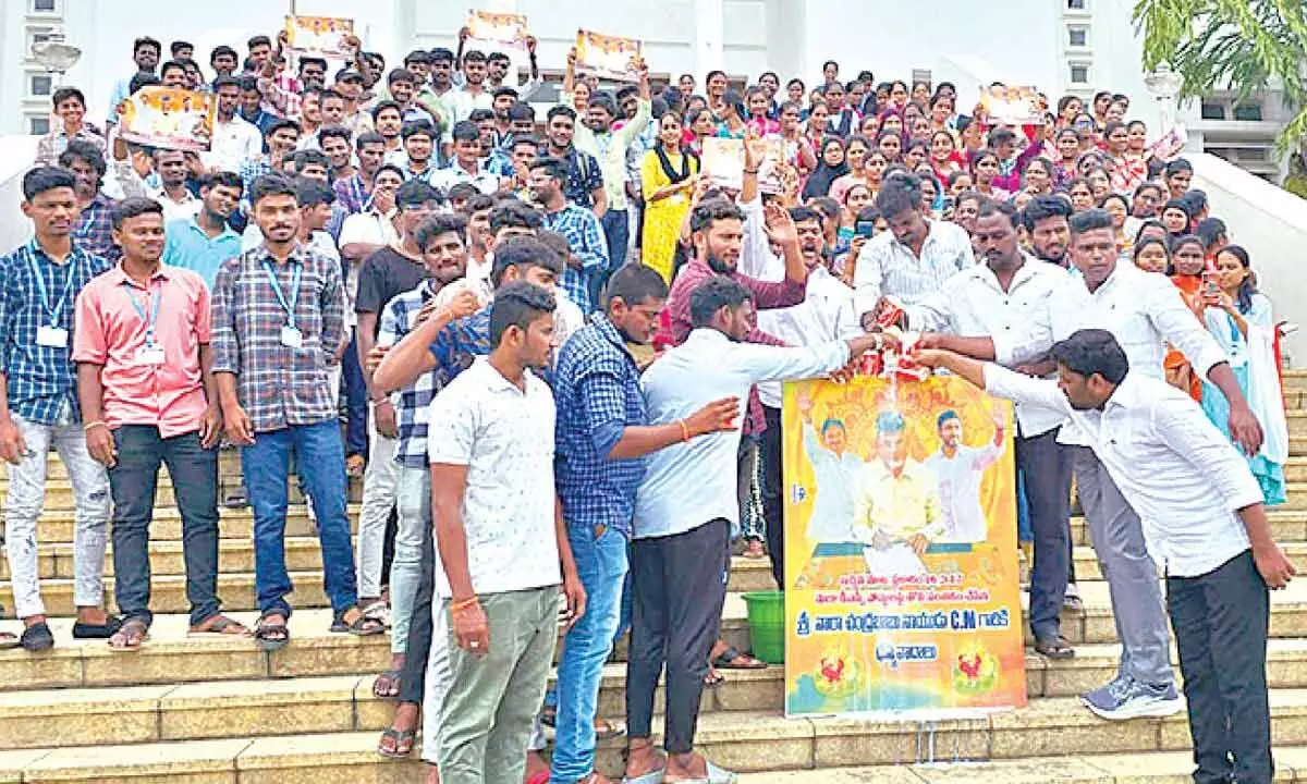 Youth performing ‘Palabhishekam’ to CM N Chandrababu Naidu’s flexi at SV University in Tirupati on Friday.Photo: Pradeep Vennelakanti