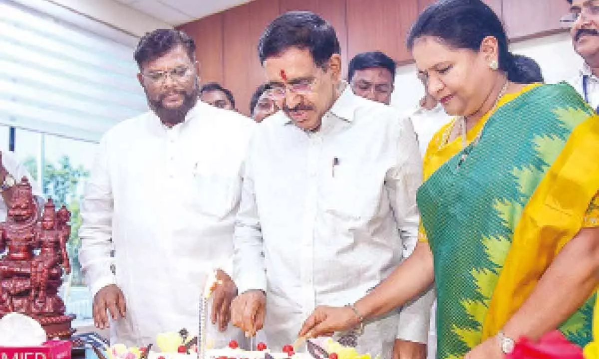 Minister for Municipal Administration and Urban Development P Narayana cutting a cake after taking charge at the Secretariat at Velagapudi on Sunday