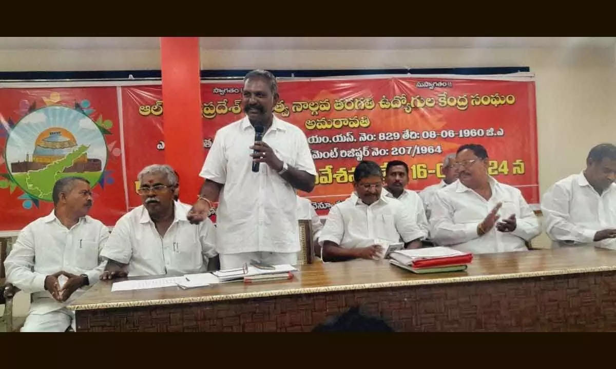 Andhra Pradesh Government Class IV Employees Association president S Malleswara Rao addressing a meeting in Vijayawada on Sunday