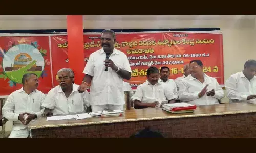 Andhra Pradesh Government Class IV Employees Association president S Malleswara Rao addressing a meeting in Vijayawada on Sunday