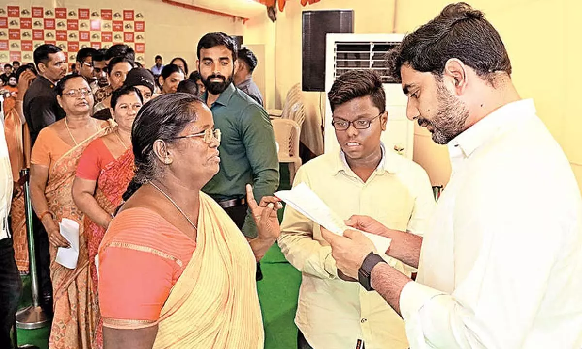 Minister Nara Lokesh receiving petitions from the public at his Undavalli residence on Tuesday
