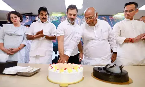 Congress MP Rahul Gandhi along with party President Mallikarjun Kharge cuts a cake during the formers birthday celebration at AICC headquarter, in New Delhi on Wednesday