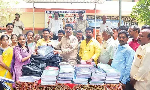 MLA Uma distributes school kits to students
