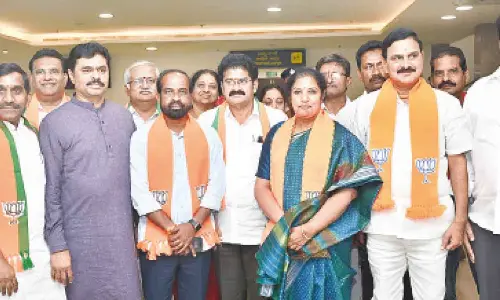 BJP State president and MP Daggubati Purandeswari, Union Minister of State for Heavy Industries and Steel Bhupatiraju Srinivasa Varma, Anakapalli MP CM Ramesh and others attending the  meeting in Vijayawada on Thursday