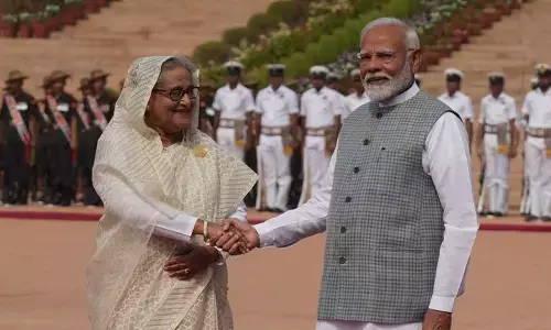 Prime Minister Narendra Modi with his Bangladeshi counterpart Sheikh Hasina during her ceremonial reception, at the Rashtrapati Bhavan in New Delhi on Saturday