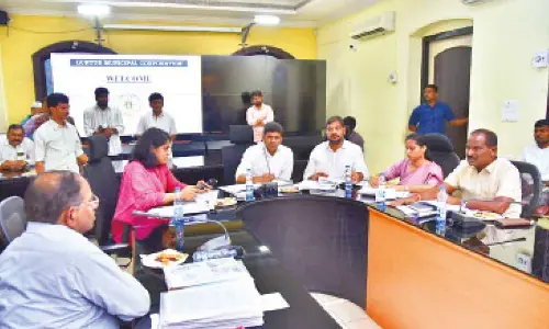Union Minister Dr Pemmasani Chandrasekhar addressing a review meeting in Guntur on Sunday. MLAs Md Naseer Ahmed, Galla Madhavi, B Ramanjaneyulu, GMC Commissioner Kirthi Chekuri are also seen
