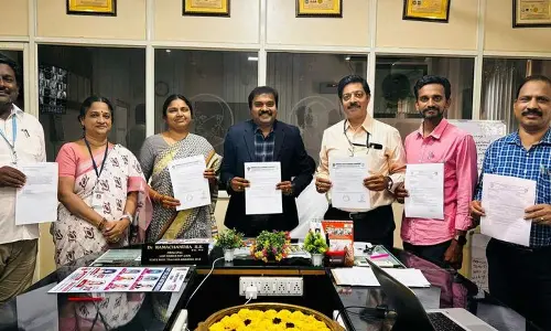 Government College Principal Dr Ramachandra handing over sanction letters to faculty members in Rajamahendravaram on Monday Government College Principal Dr Ramachandra handing over sanction letters to faculty members in Rajamahendravaram on Monday