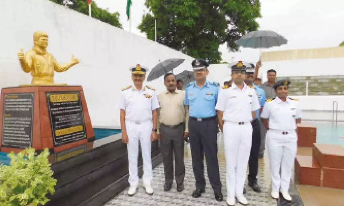 Rear Admiral M Murali Mohan Raju and others at swimming pool inauguration programme at Sainik School Korukonda on Thursday