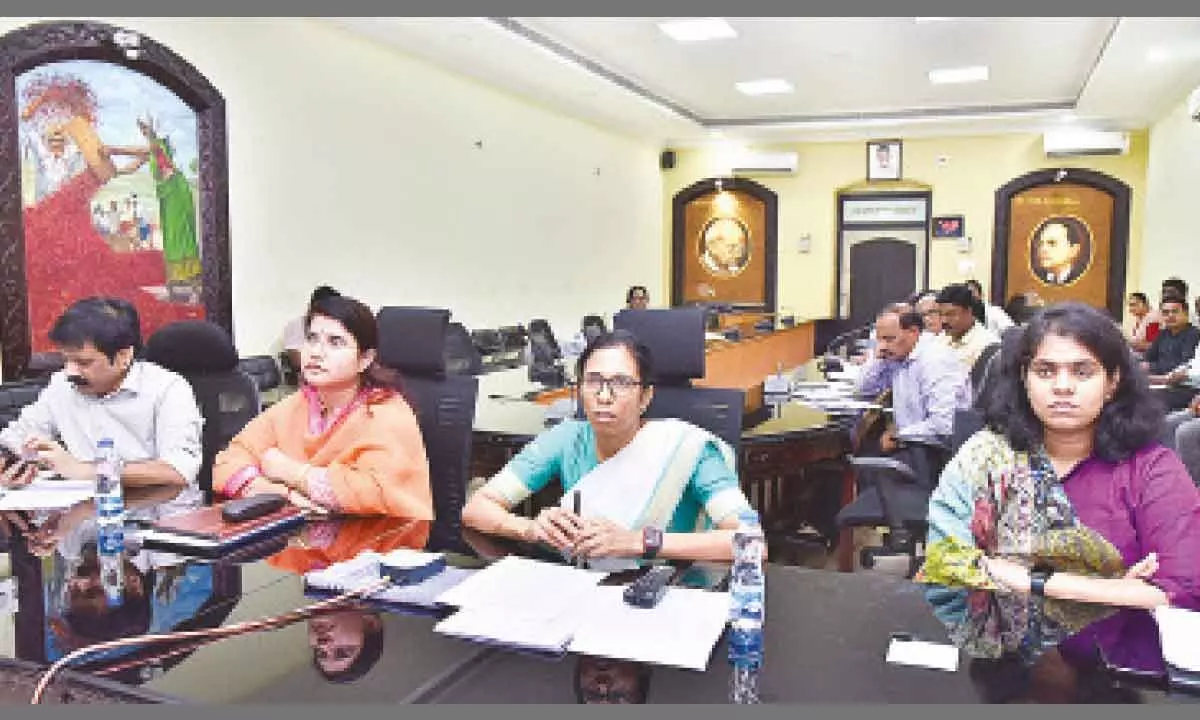Collector S Nagalakshmi along with Joint Collector G Rajakumari and GMC Commissioner Kirthi Chekuri holding a video conference with the municipal commissioner and MPDOs from the Collectorate in Guntur on Thursday
