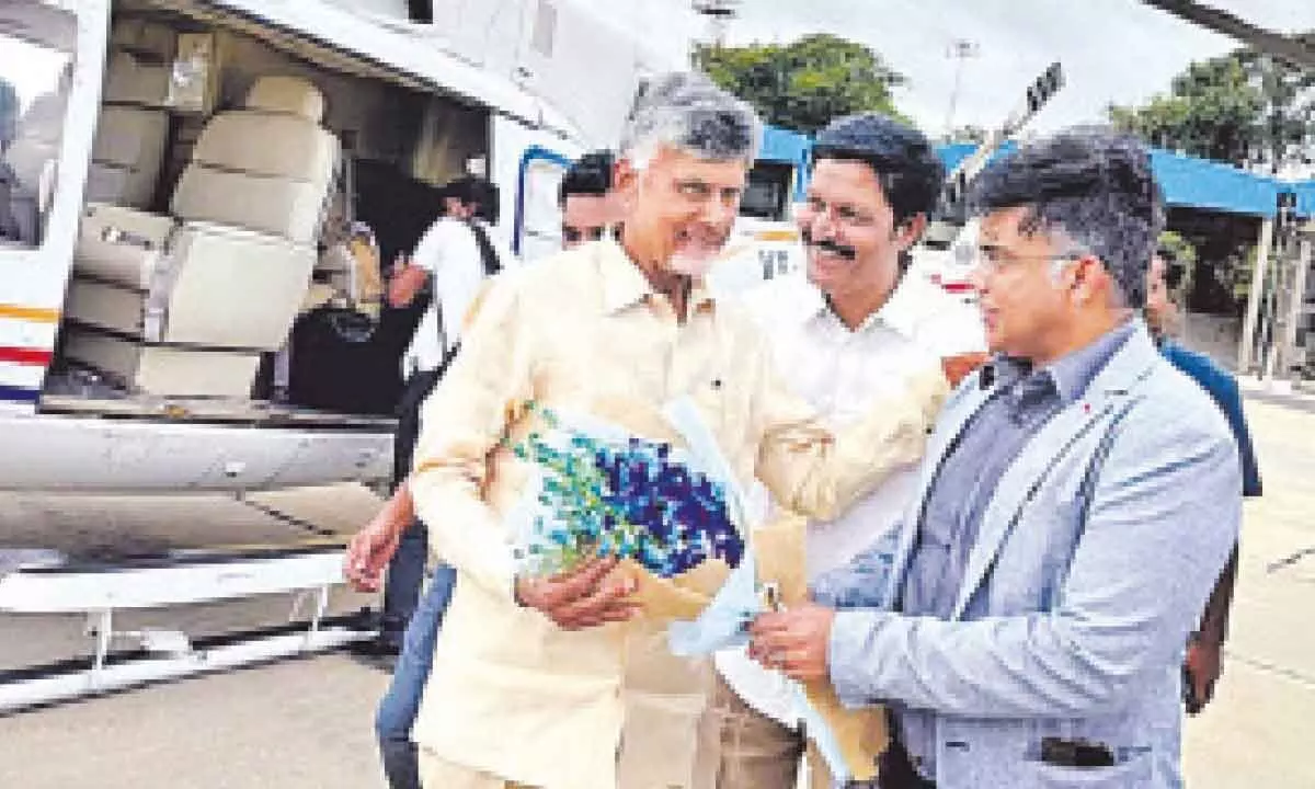 Chief Minister N Chandrababu Naidu meets executive director Ashin Pai and managing director Ravindra Pai at Bengaluru airport while returning from Chittoor on Wednesday