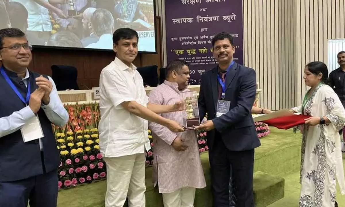 Former Collector of NTR district S Dilli Rao receiving a certificate of appreciation from  Union Minister of State for Home Nityanand Rai in New Delhi on Sunday