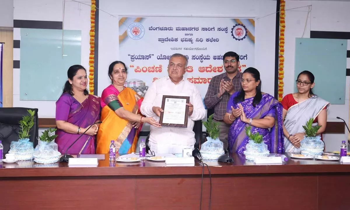 Minister Ramalinga Reddy distributes pension order letters under Prayaas Scheme to BMTC Employees