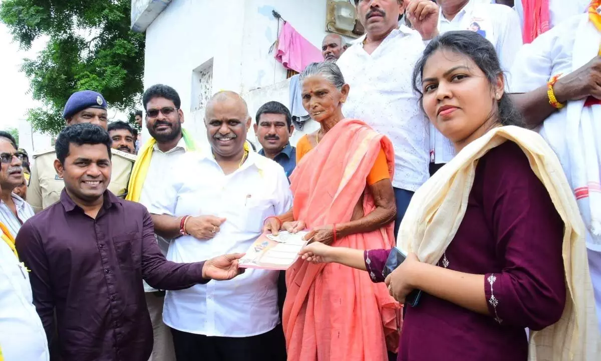 Minister for Stamps and Registrations Anagani Satya Prasad distributing pensions under NTR Bharosa Scheme in Repalle on Monday