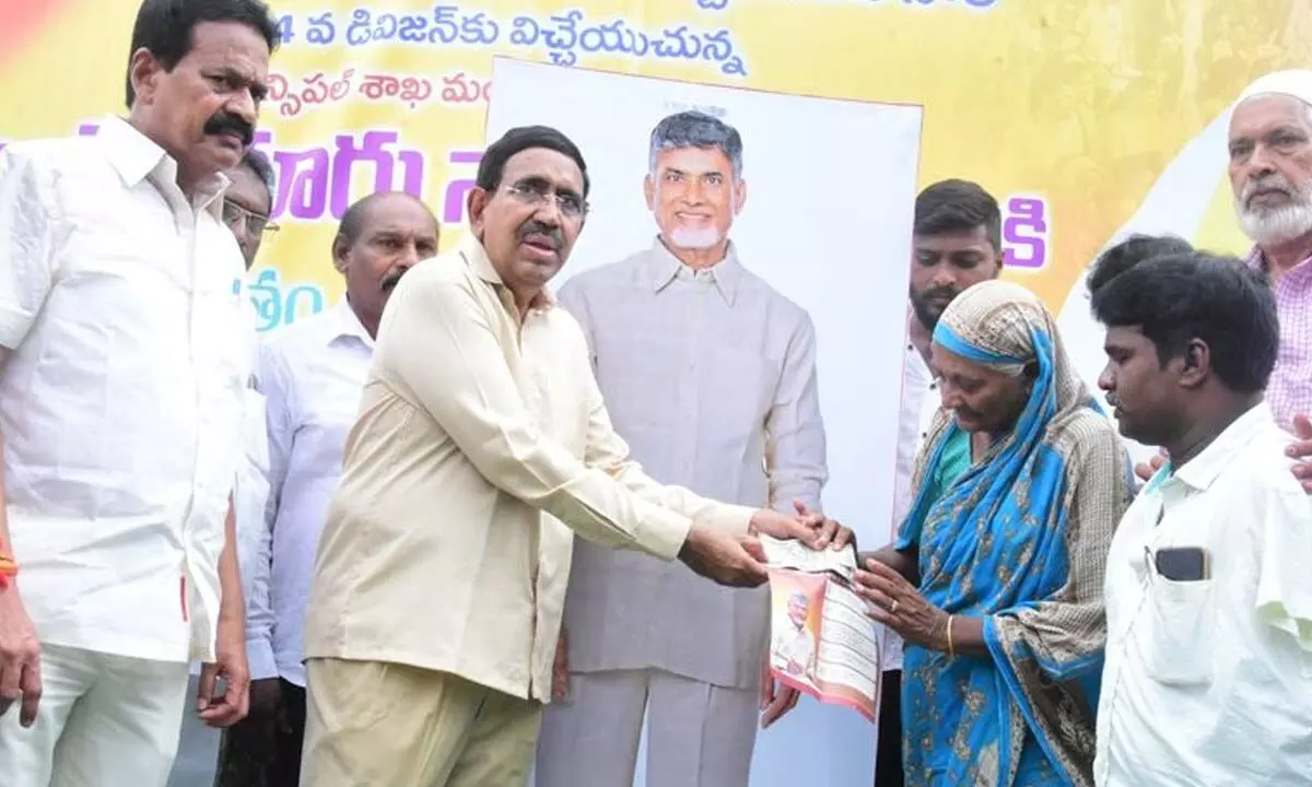 MA&UD Minister Ponguru Narayana handing over pension to a woman in Nellore city on Monday