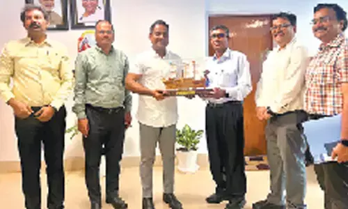 General manager of ECoR Parmeshwar Funkkwal with M Angamuthu chairperson of VPA in Visakhapatnam on Tuesday