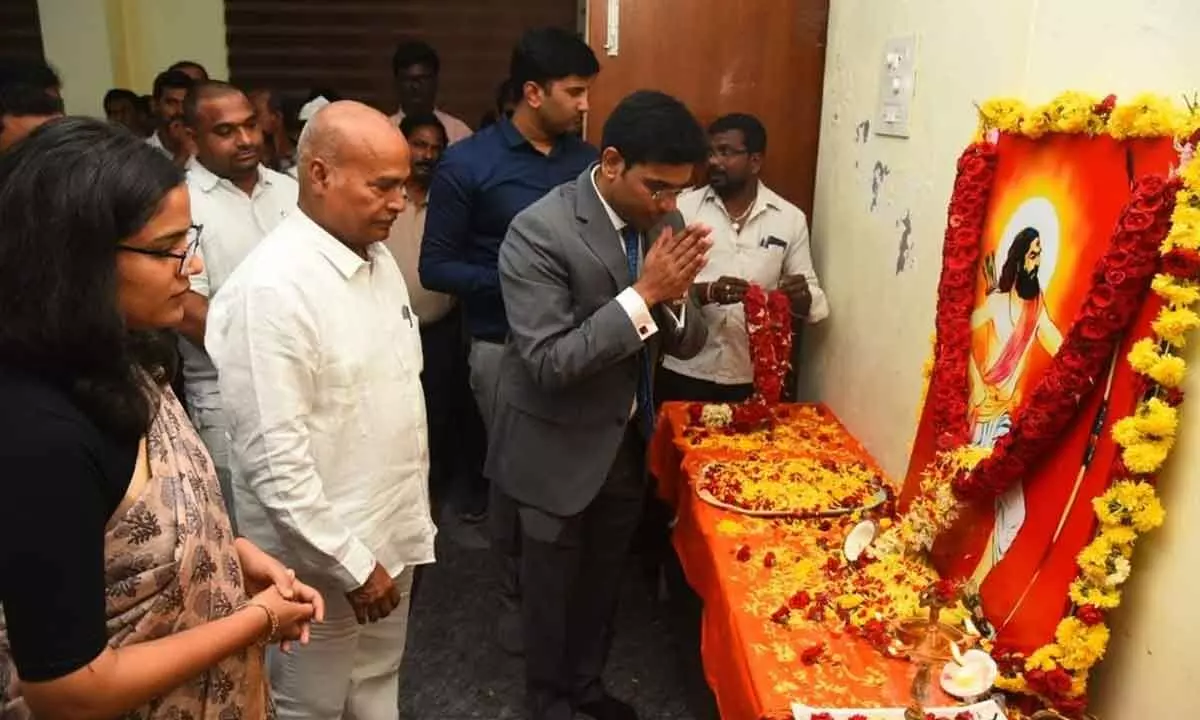 District Collector Dr S Venkateswar paying floral tributes to the portrait of Alluri Sitarama Raju at Tirupati Collectorate on Thursday