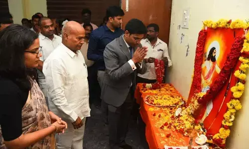 District Collector Dr S Venkateswar paying floral tributes to the portrait of Alluri Sitarama Raju at Tirupati Collectorate on Thursday