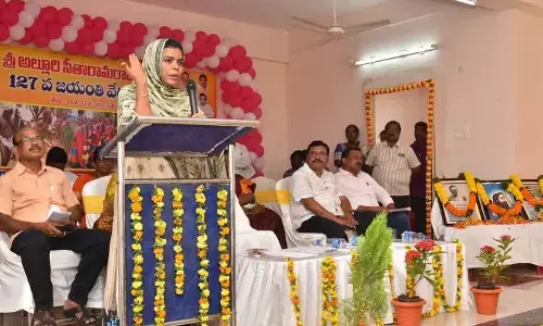 Collector A Thameem Ansariya speaking at the celebrations of 127th birth anniversary of Alluri Sitarama Raju in Ongole on Thursday