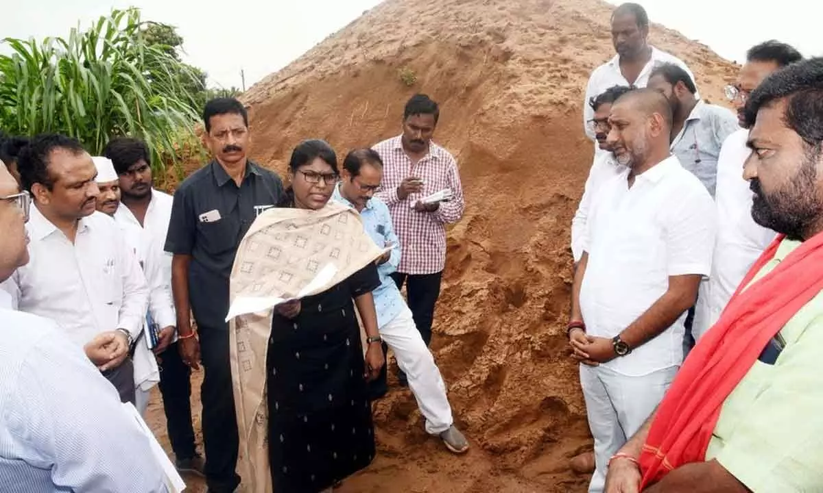 Collector K Vetri Selvi inspecting a sand stock point at Chebrolu on Sunday