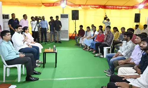 Education, IT and electronics minister Nara Lokesh addressing 25 differently-abled students who obtained admissions in high-profile educational institutions, after distributing laptops to them at his residence in Undavalli on Monday