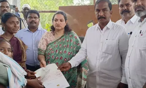 Collector G Srijana on Monday handing over a compensation of Rs 50 lakh to the kin of the worker died in the Ultra Tech cement company boiler explosion at Budavada village near Jaggaiahpet on Sunday