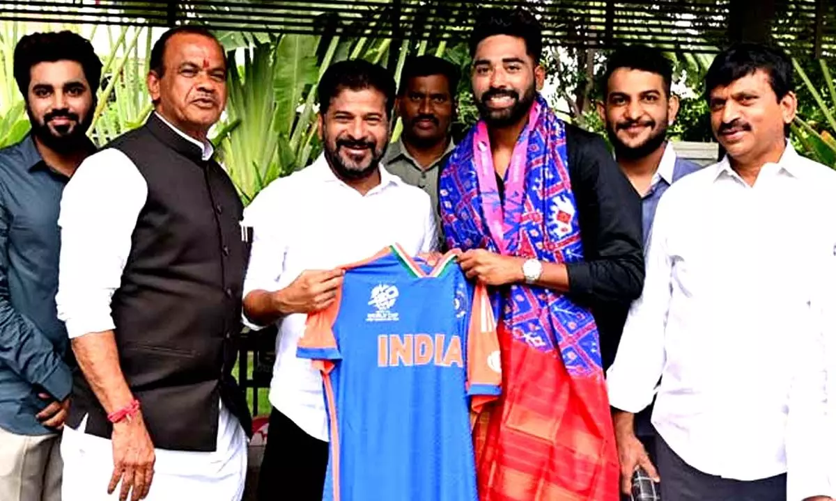 Indian Cricketer Mohammed Siraj meets Revanth Reddy, presents team India jersey