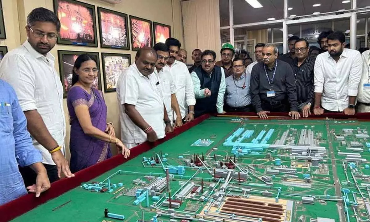 Union Minister HD Kumaraswamy with MoS Bhupathiraju Srinivasa Varma, VSP CMD Atul Bhat, Joint Secretary Sanjay Roy, and other senior officers inspecting the miniature model of the Vizag Steel (Rashtriya Ispat Nigam-RINL) factory in Visakhapatnam