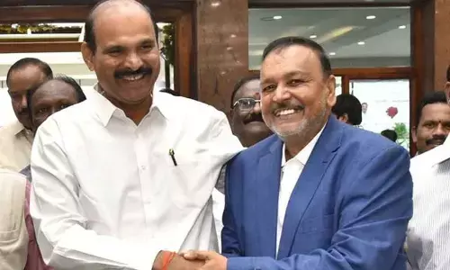 Minister for housing, information and public relations Kolusu Parthasarathy greets APNGOs association leader Md Iqbal at his retirement function in Vijayawada on Sunday