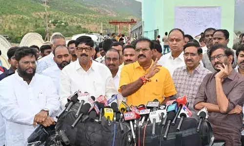 Water Resources Minister Nimmala Ramanaidu addressing mediapersons after holding a review meeting with officials at Somasila dam on Sunday
