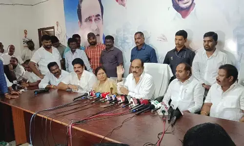 Former minister Balineni Srinivasa Reddy speaking at a press meet in Ongole on Monday