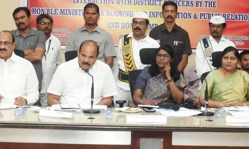 Minister Kolusu Parthasarathy speaking at a review meeting in Eluru on Monday