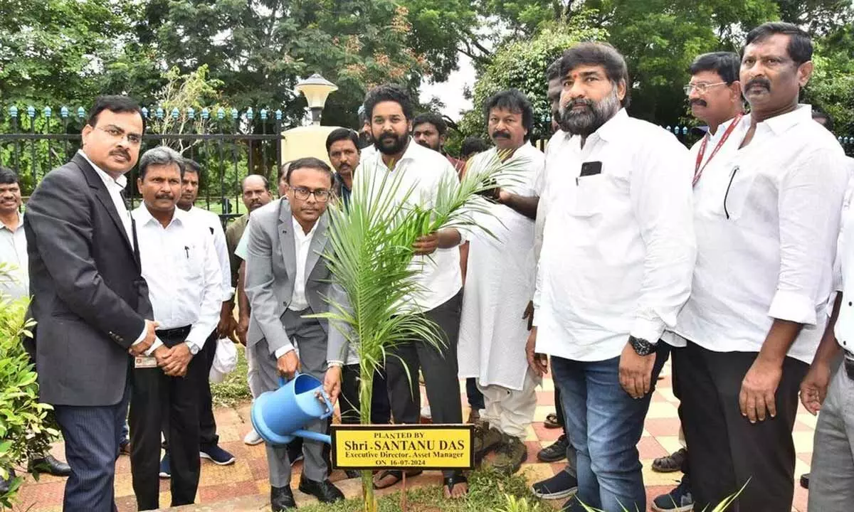 Amalapuram MP GM Harish Balayogi planting a sapling on ONGC Rajahmundry  Asset premises on Tuesday. ED Asset Manager Santanu Das and others are also seen.