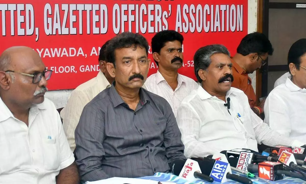 AP NGOs state president K V Siva Reddy, secretary Chowdary Purushottam Naidu and A Vidya Sagar addressing a press conference at NGO Home in Vijayawada on Tuesday  Photo Ch Venkata Mastan