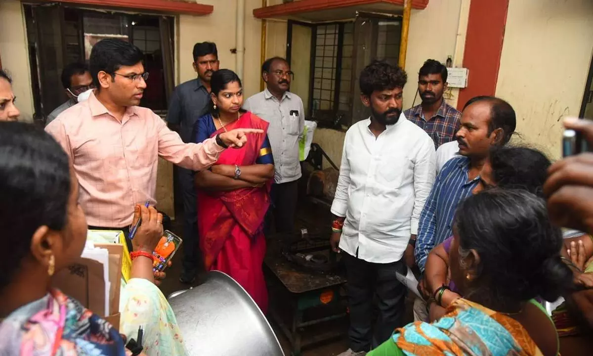 District collector Dr S Venkateswar warns the Gurukulam officials about the poor sanitation in the kitchen