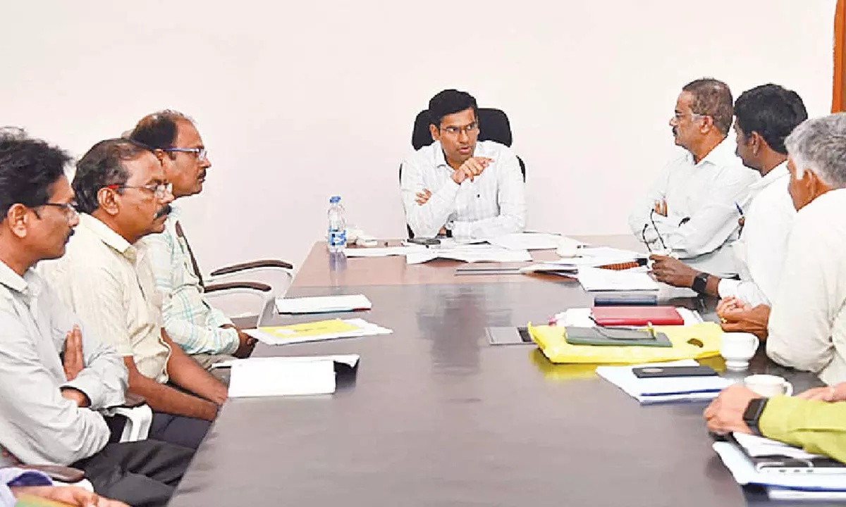 District Collector Dr S Venkateswar holding a review meeting with the officials of the Industries department and APIIC in Tirupati on Tuesday