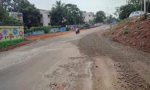 A stretch of road at Kailasapuram getting repaired ahead of Giri  Pradakshina in Visakhapatnam.