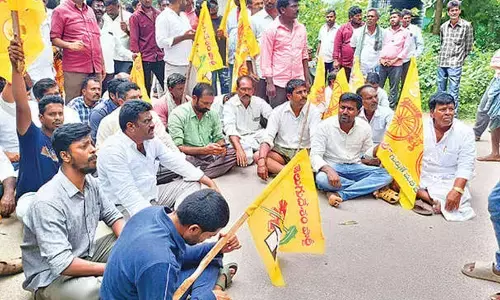 TDP activists staging a protest before MLA Peddireddi Dwarakanatha Reddy’s house in Thamballapalle on Tuesday