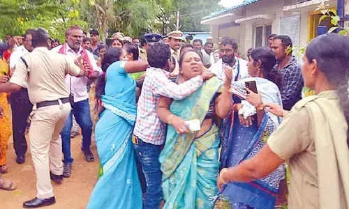 Relatives of deceased student Saraswathi attacking the BC gurukul principal Vikayalaxmi