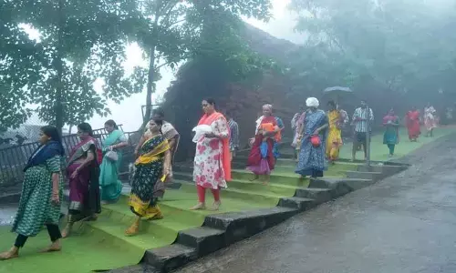 Getting drenched, devotees participate in Giri Pradakshina in Visakhapatnam