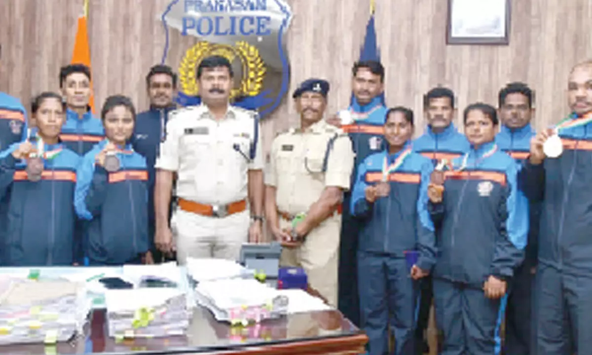 Prakasam SP A R Damodar and AR Additional SP Ashok Babu appreciating police personnel for winning medals at AIP Judo Cluster- 2024, in Ongole on Monday