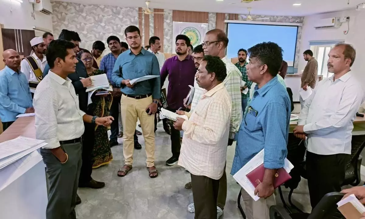 Alluri Sitarama Raju District Collector A S Dinesh Kumar giving instructions to the staff at the  Command Control Room at Chinturu ITDA on Monday