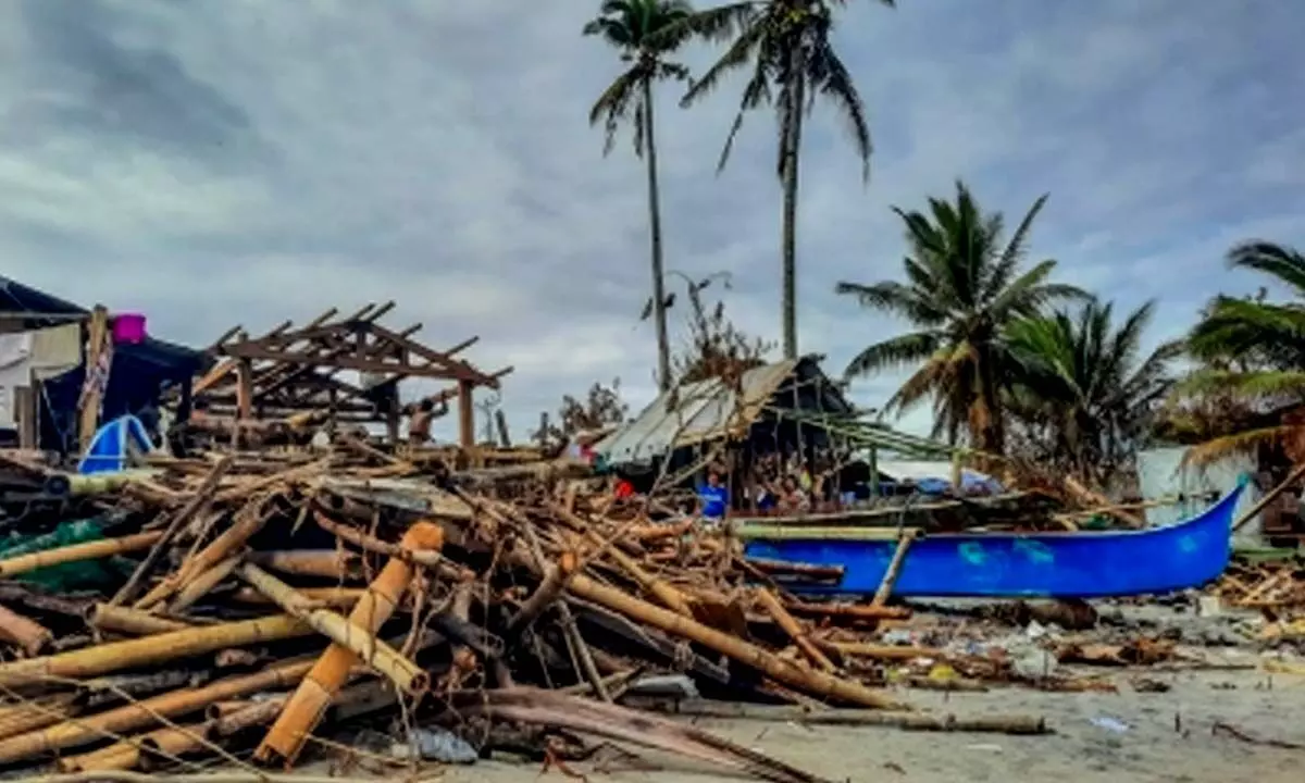 Typhoon buffets Philippines, killing at least eight