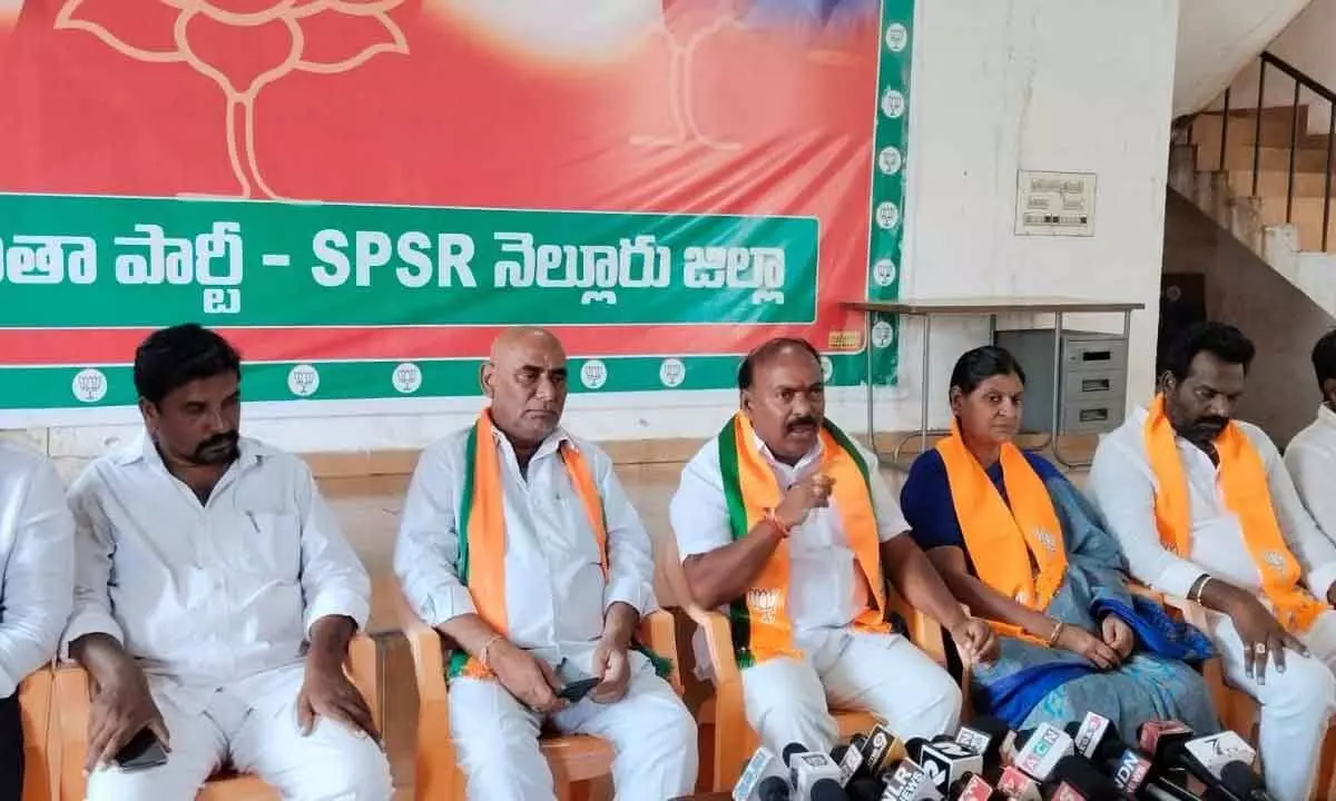 BJP State Executive Committee member G Bharath Kumar Yadav addressing a press conference at party district office in Nellore on Thursday