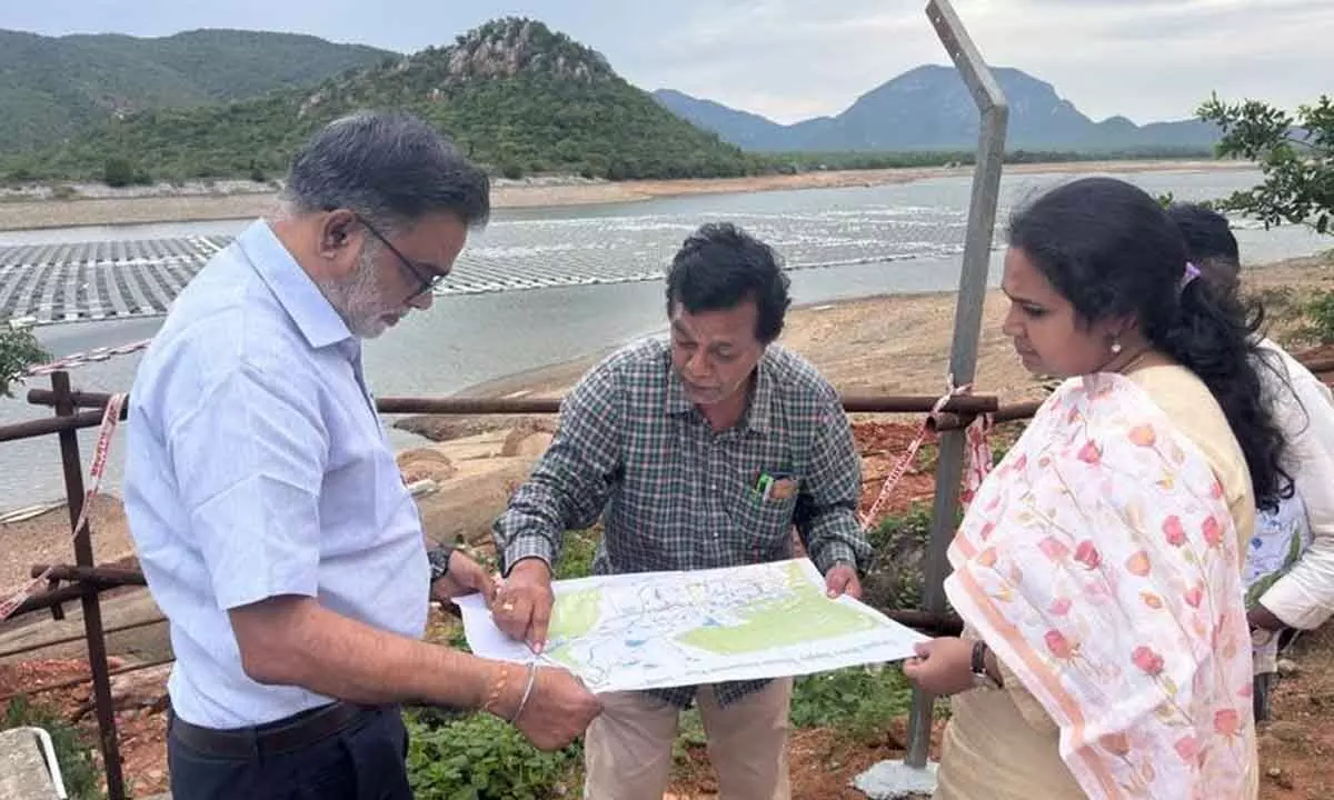 Commissioner Narapureddy Mourya and other officials at  Kandaleru dam in Tirupati on Thursday