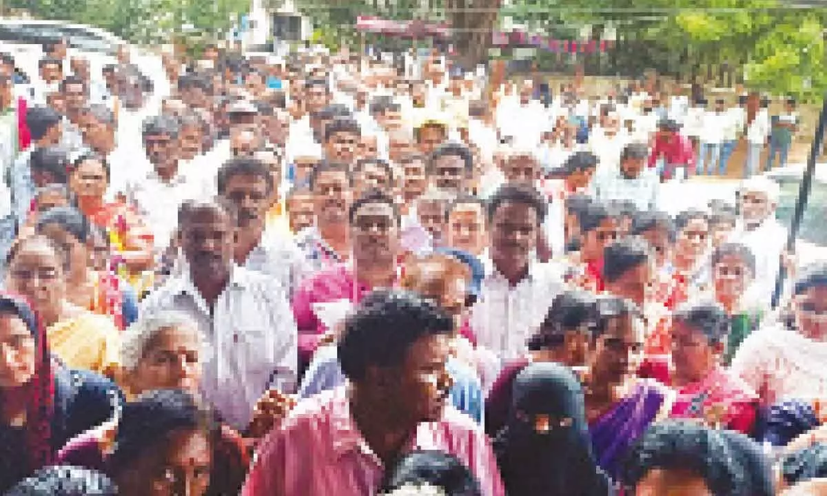 People waiting at the sub-collector office in Madanapalle to submit their grievances to the special chief secretary R P Sisodia on Thursday